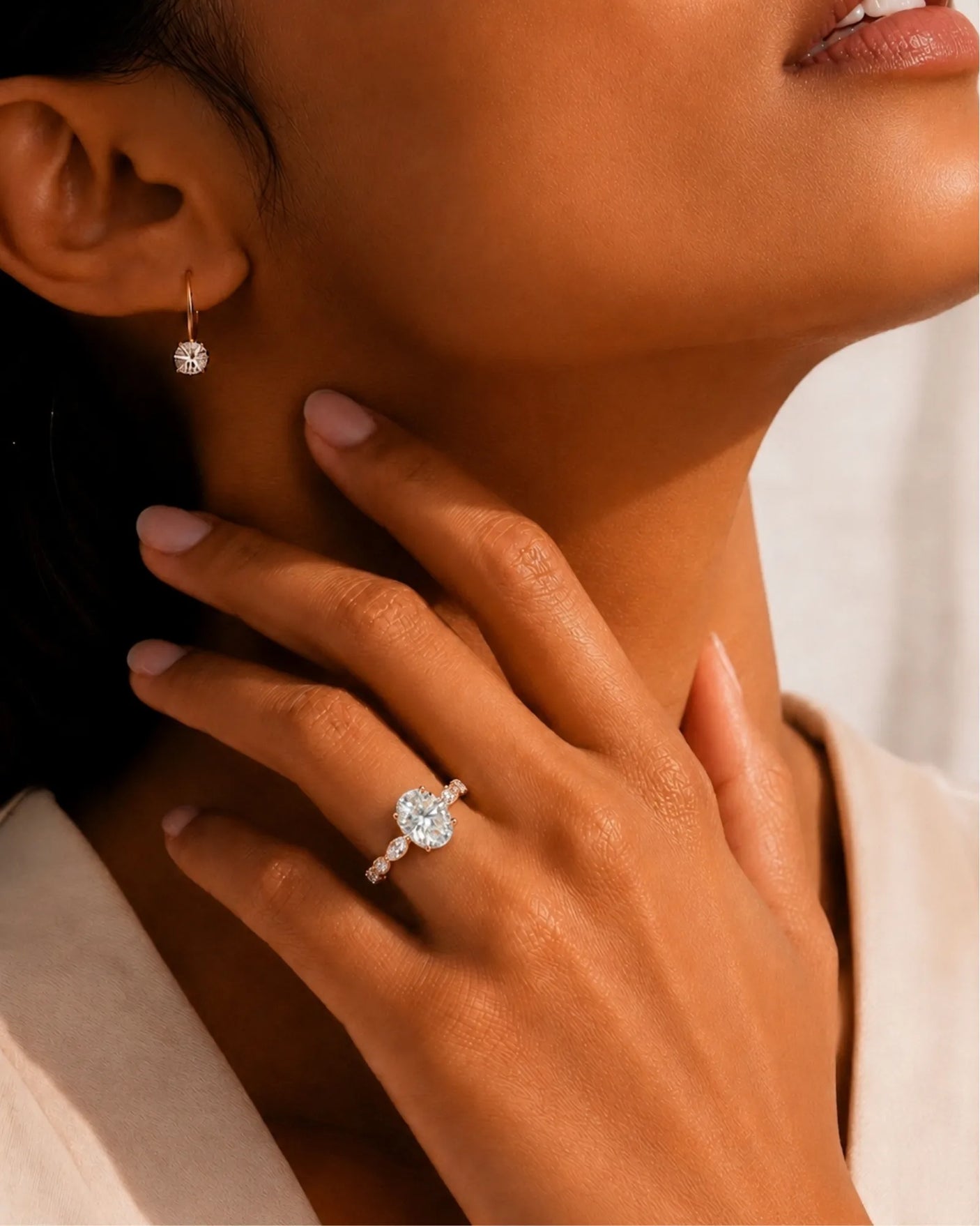 Elegant oval moissanite proposal ring with symmetrical marquise shoulders crafted in 18K rose gold | SARATTI