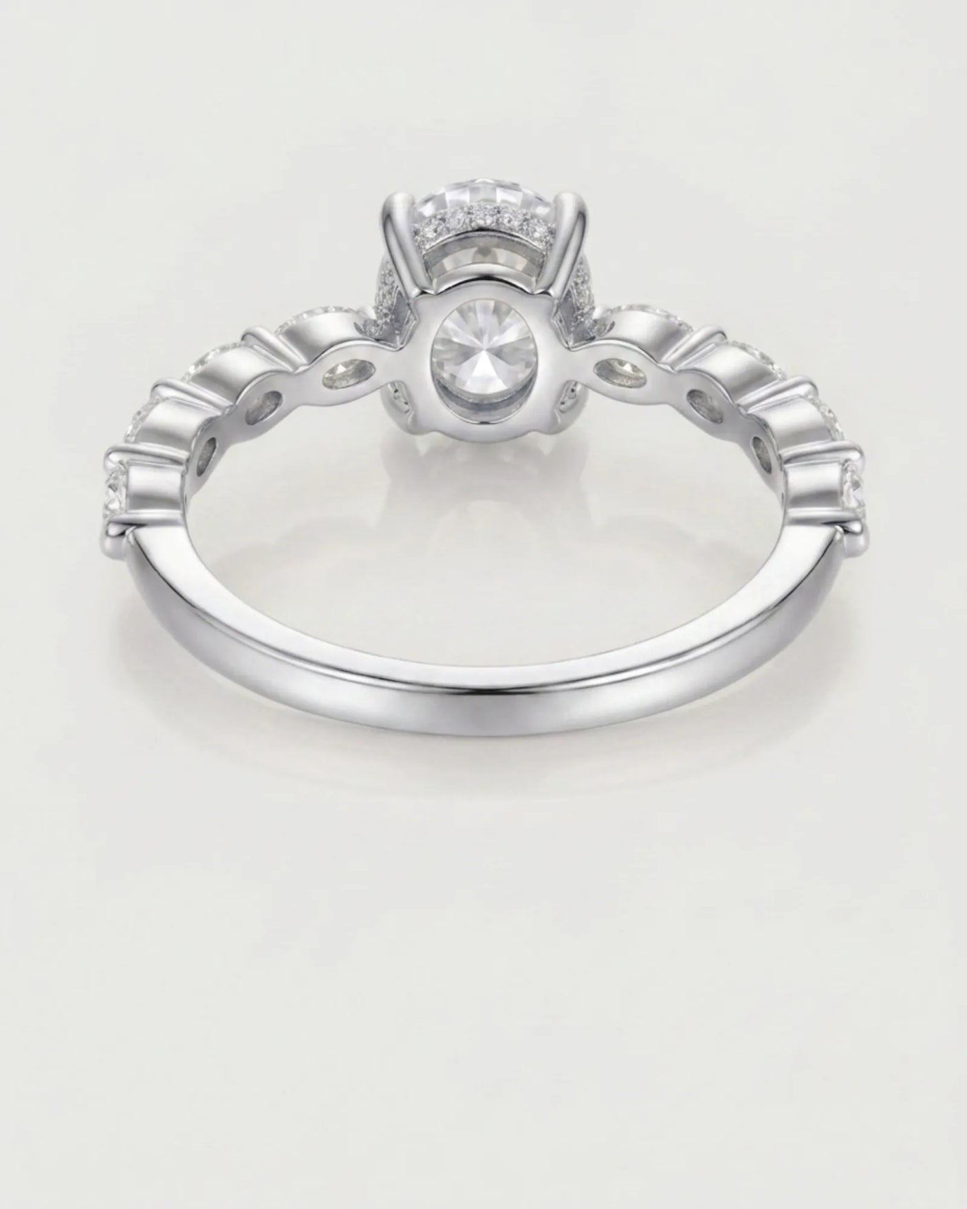 Elegant oval moissanite proposal ring with symmetrical marquise shoulders crafted in 18K white gold | SARATTI