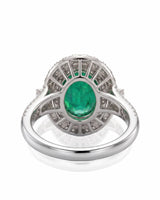 Elegant oval natural emerald ring with diamond shoulders in 18K white gold | SARATTI