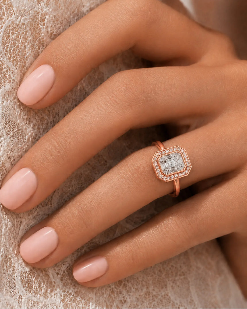 Elegant radiant moissanite bezel ring with clipped-corner halo in 18K rose gold | SARATTI