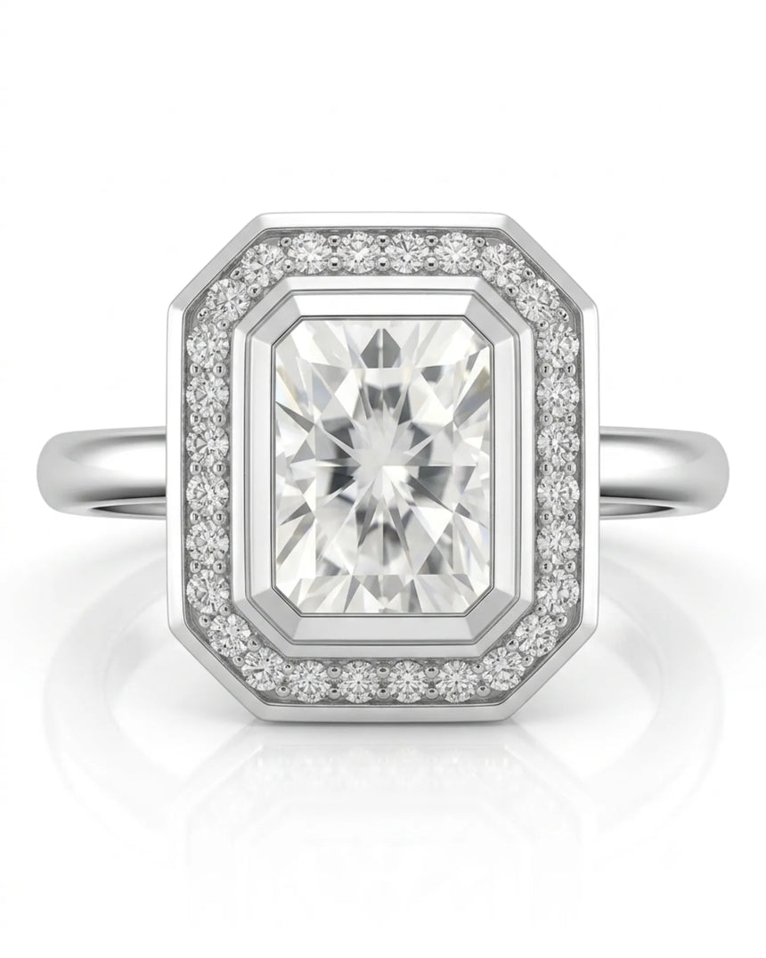 Elegant radiant moissanite bezel ring with clipped-corner halo in platinum | SARATTI
