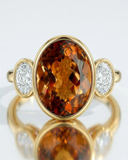 Elevated setting allows light to move through the center gemstone in yellow gold | SARATTI