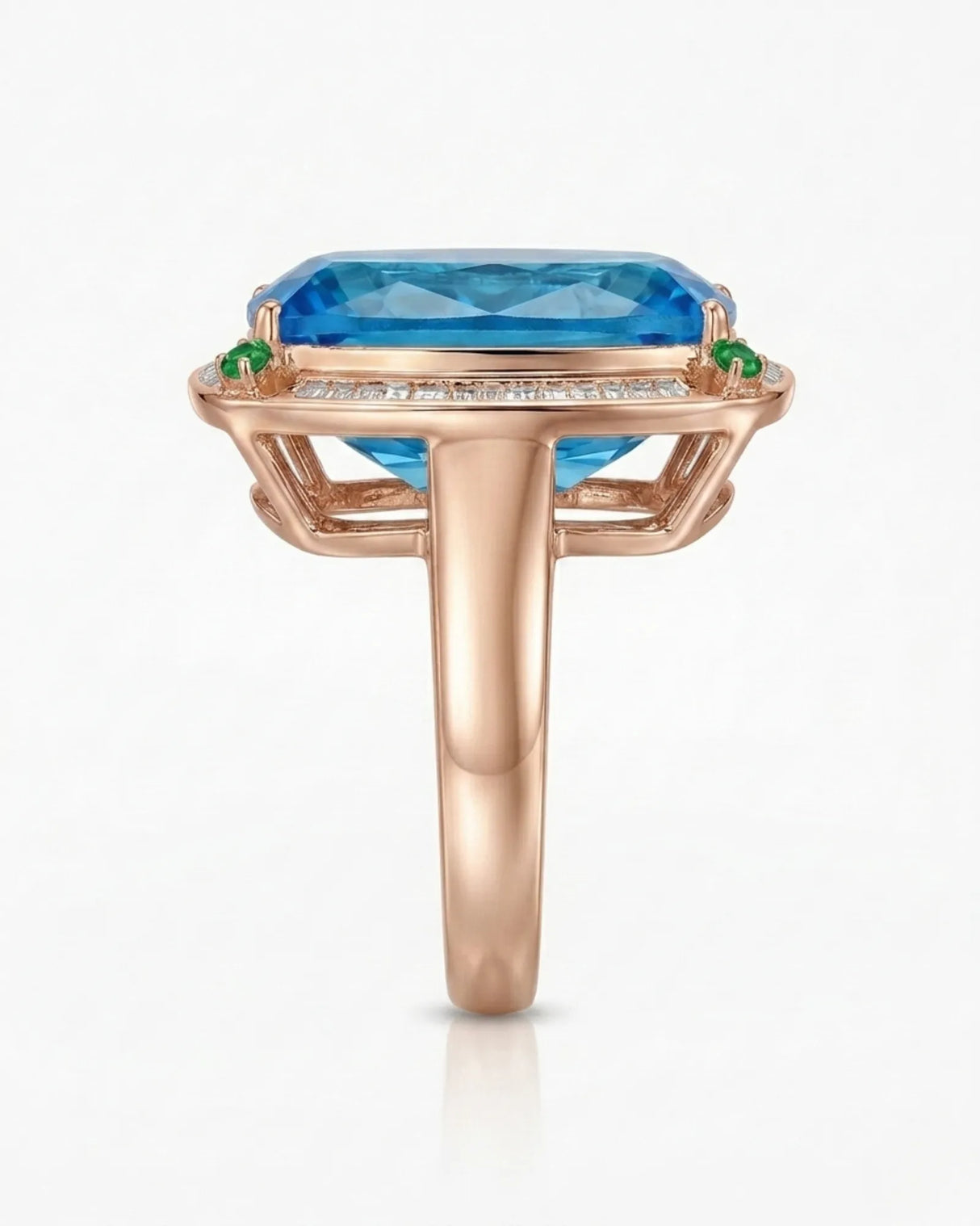 Elongated cushion Swiss Blue topaz ring bordered by baguette diamonds in polished 18K rose gold | SARATTI