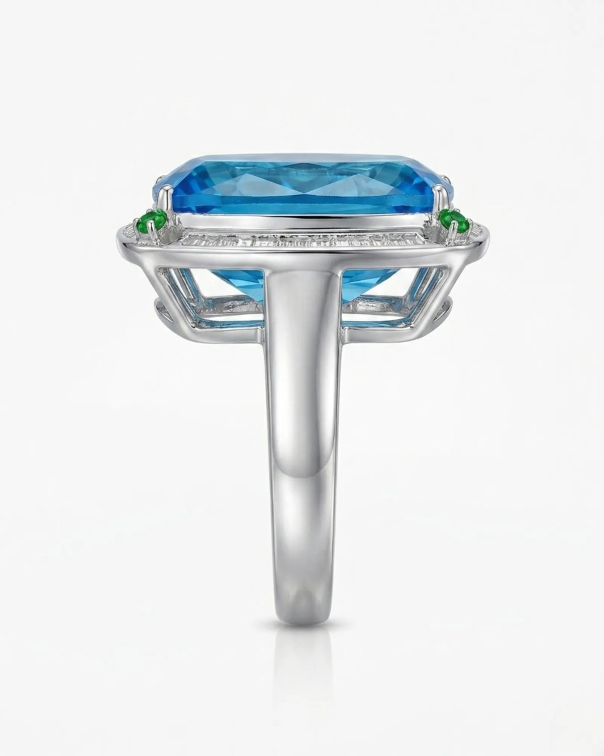 Elongated cushion Swiss Blue topaz ring bordered by baguette diamonds in polished platinum | SARATTI