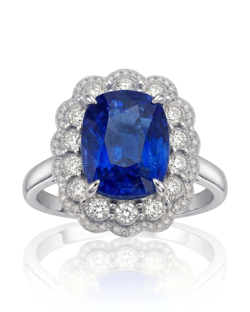 Elongated cushion natural sapphire ring framed by round diamonds in 18K white gold | SARATTI