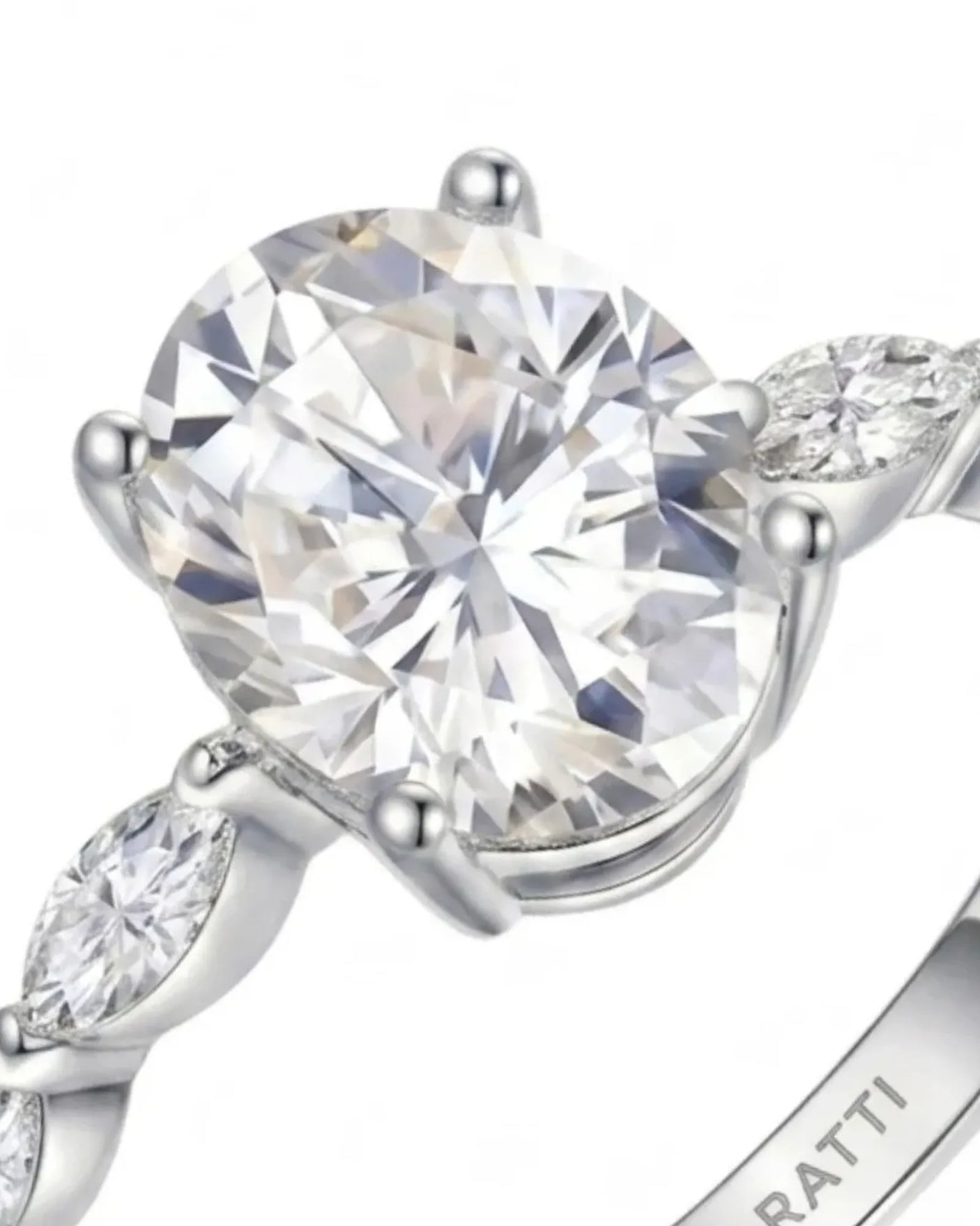 Elongated oval moissanite ring with leaf-like marquise accents and enduring polished platinum setting | SARATTI