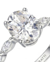 Elongated oval moissanite ring with leaf-like marquise accents and enduring polished platinum setting | SARATTI