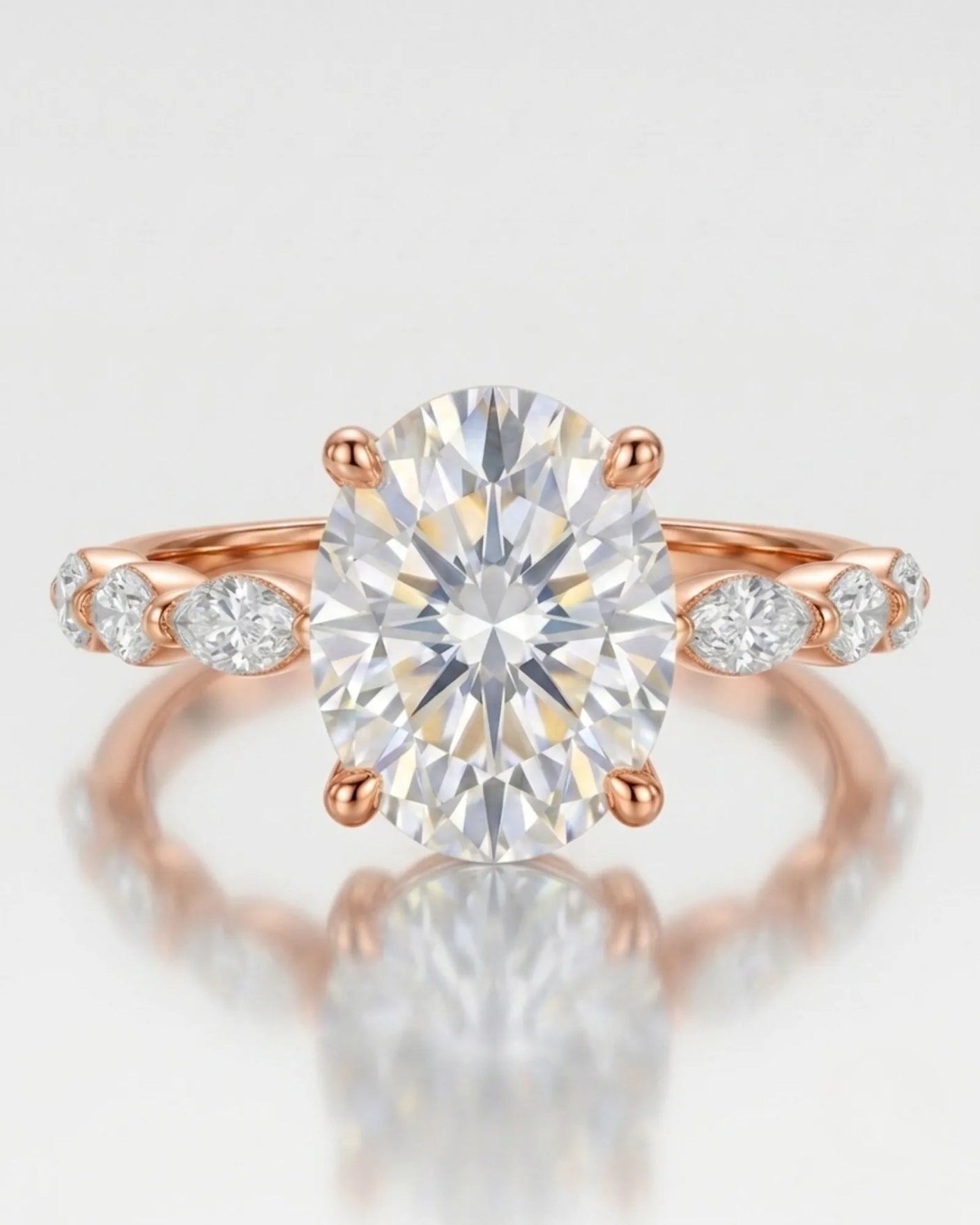 Elongated oval moissanite ring with leaf-like marquise accents and romantic 18K rose gold setting -- SARATTI