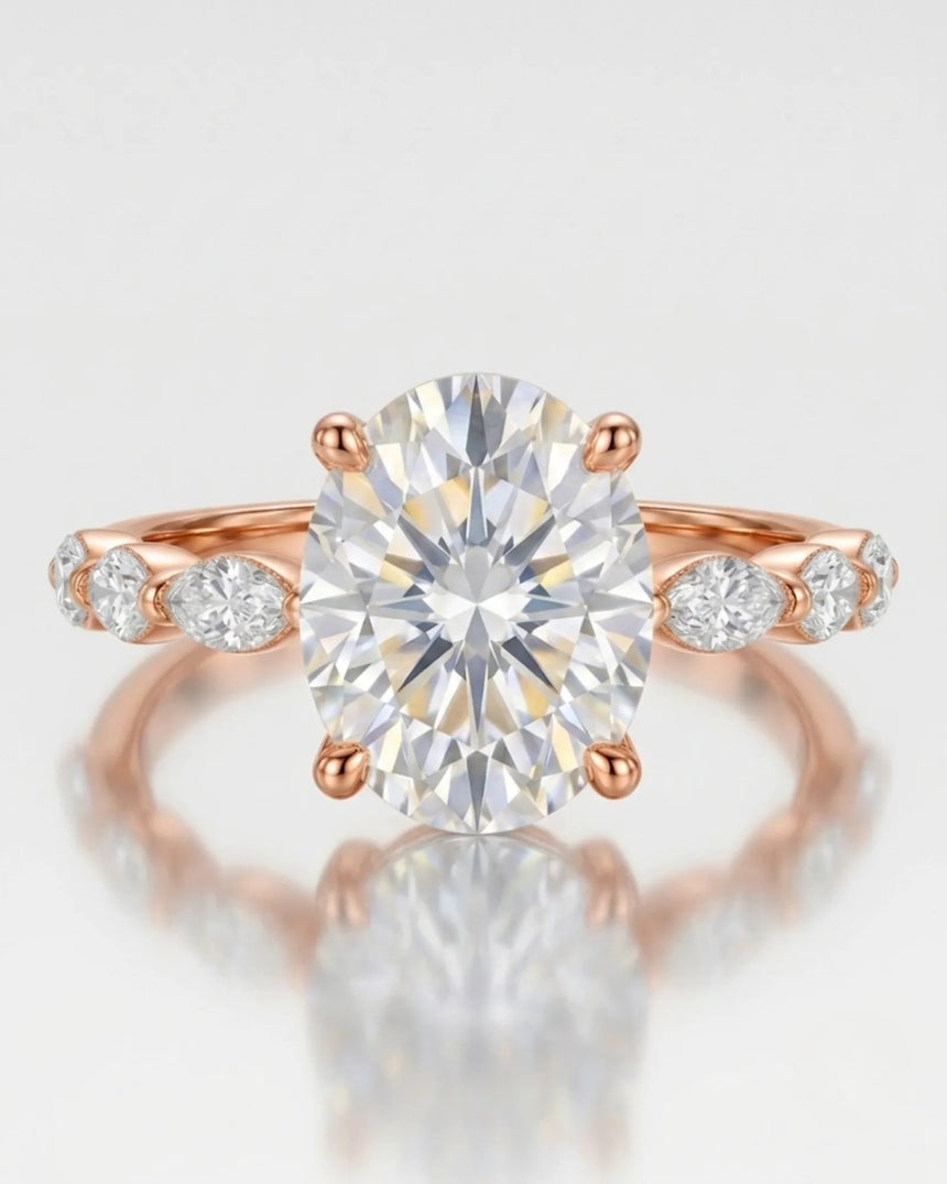 Elongated oval moissanite ring with leaf-like marquise accents and romantic 18K rose gold setting -- SARATTI