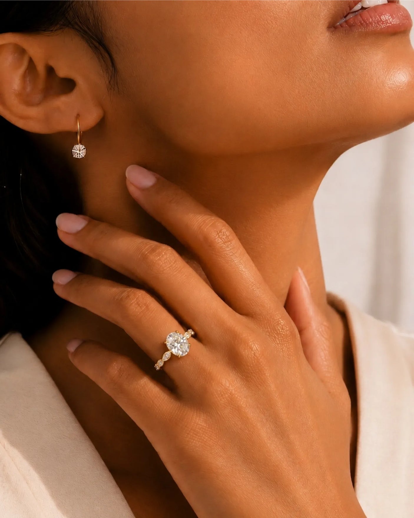 Elongated oval moissanite ring with leaf-like marquise accents and warm 18K yellow gold setting | SARATTI