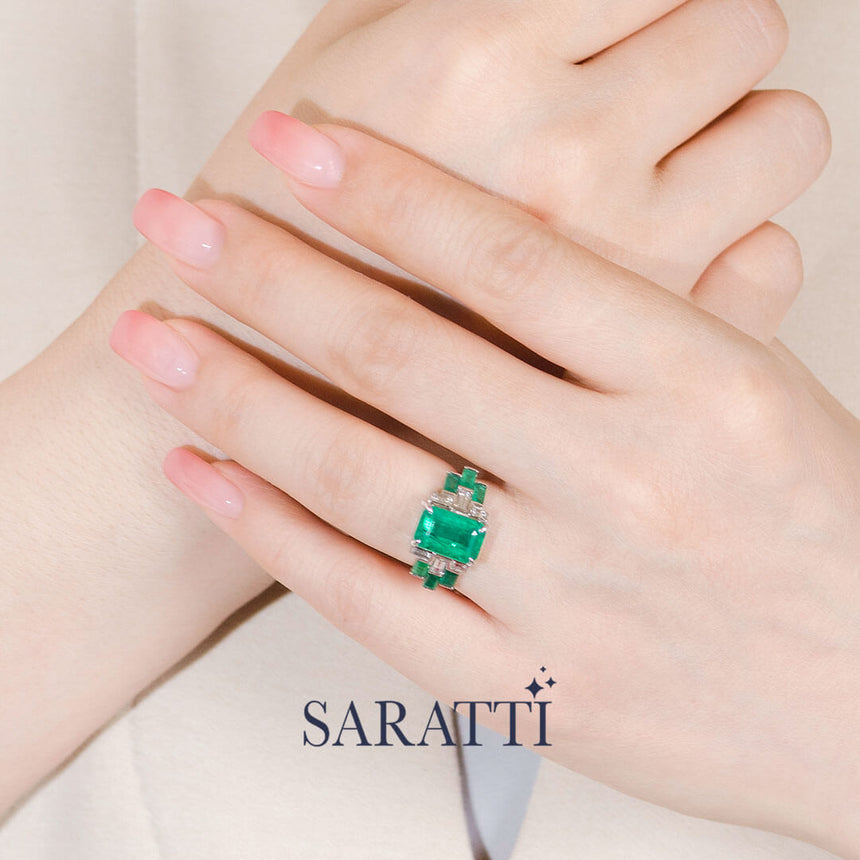 Model wears the Héritage Picasso Emerald & Diamond Ring | Saratti