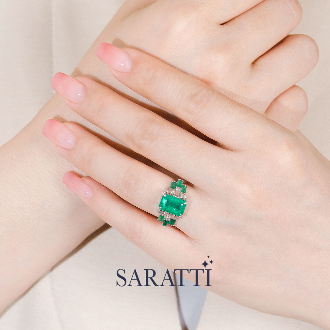 Model wears the Héritage Picasso Emerald & Diamond Ring | Saratti