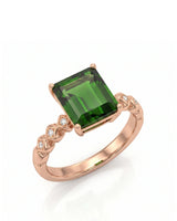 Emerald-cut green tourmaline diamond ring with sculpted geometric shoulders in 18K rose gold | SARATTI