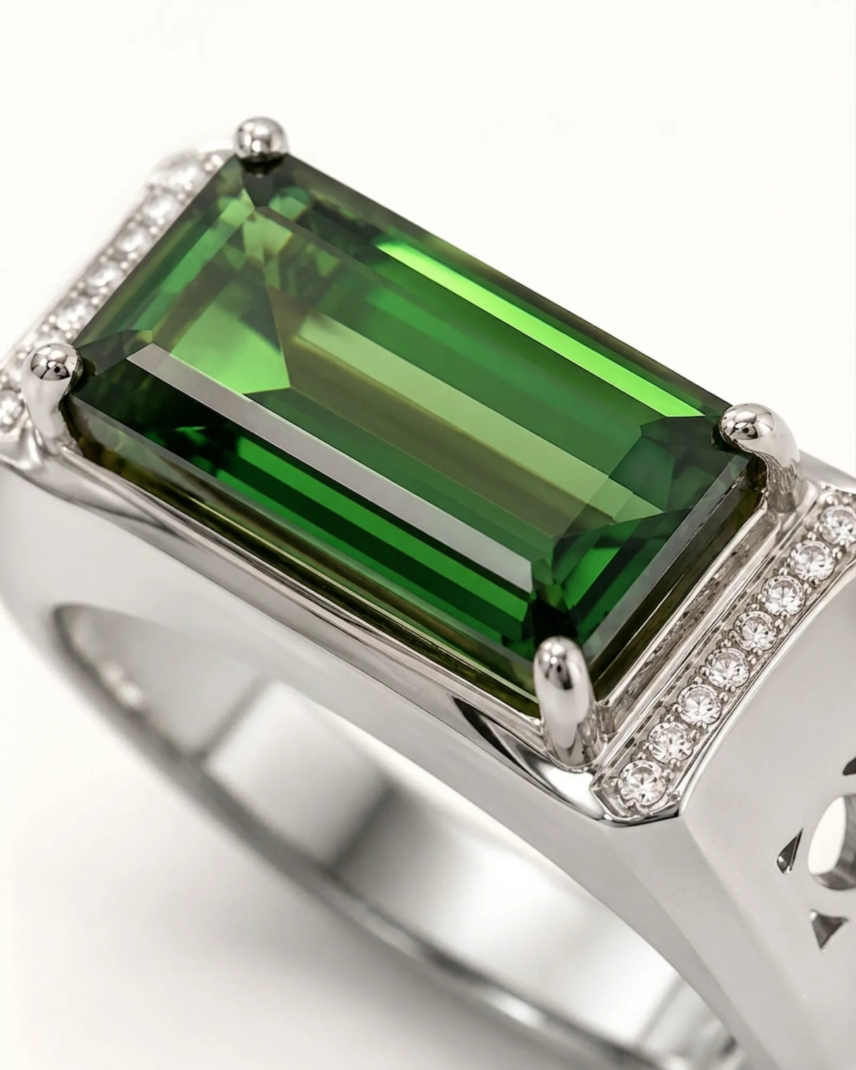 Emerald-cut green tourmaline ring with round brilliant diamonds in polished yellow gold | SARATTI
