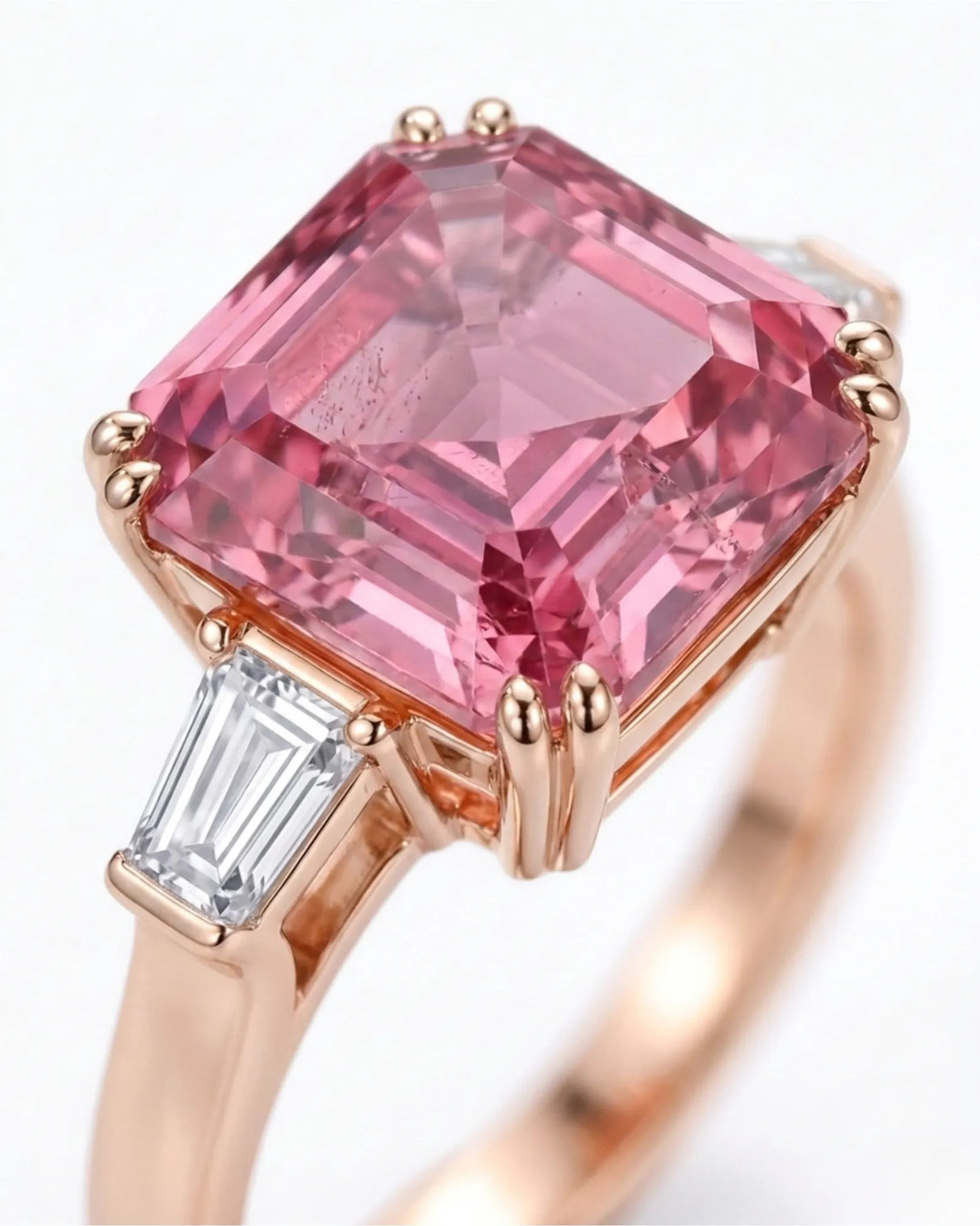 Emerald-cut pink tourmaline ring with baguette-cut diamonds in 18K rose gold | SARATTI