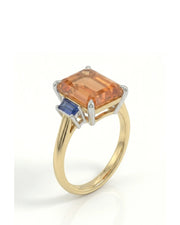 Emerald cut Natural Imperial Topaz three-stone setting in 18K yellow gold | SARATTI