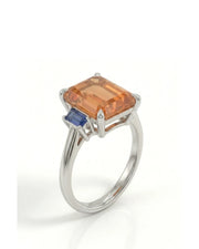 Emerald cut Natural Imperial Topaz three-stone setting in platinum | SARATTI