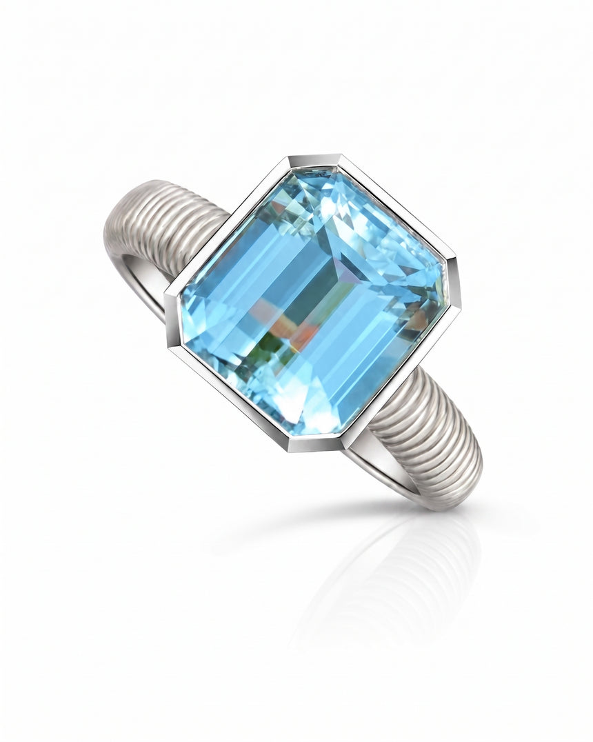 Emerald cut aquamarine bezel solitaire engagement ring in Platinum | SARATTI