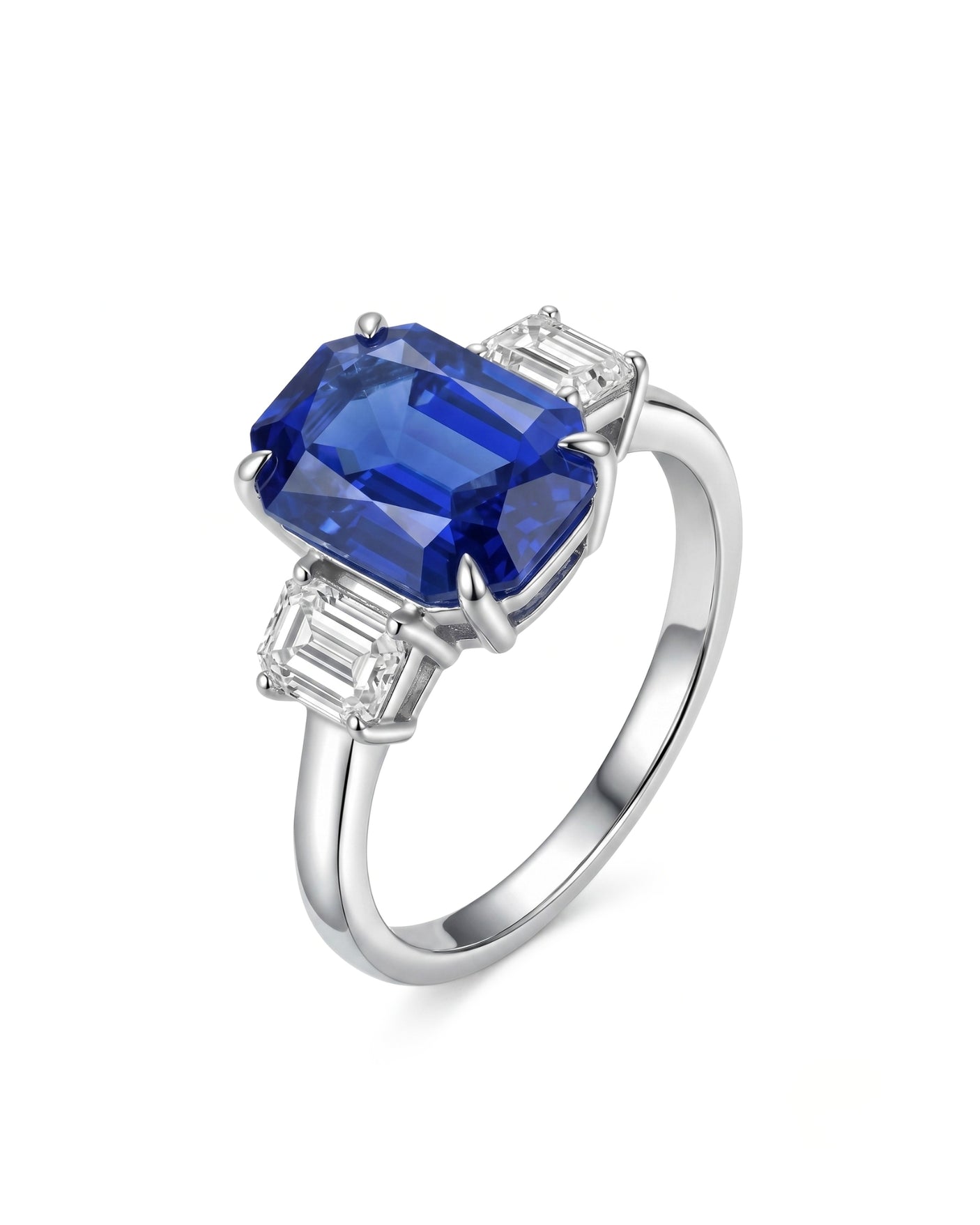 Emerald cut blue sapphire ring with emerald cut diamond accents in 18K white gold | SARATTI