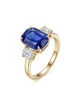 Emerald cut blue sapphire ring with emerald cut diamond accents in 18K yellow gold | SARATTI