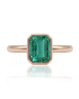 Emerald cut natural emerald ring with clean bezel design in 18K Rose Gold | SARATTI