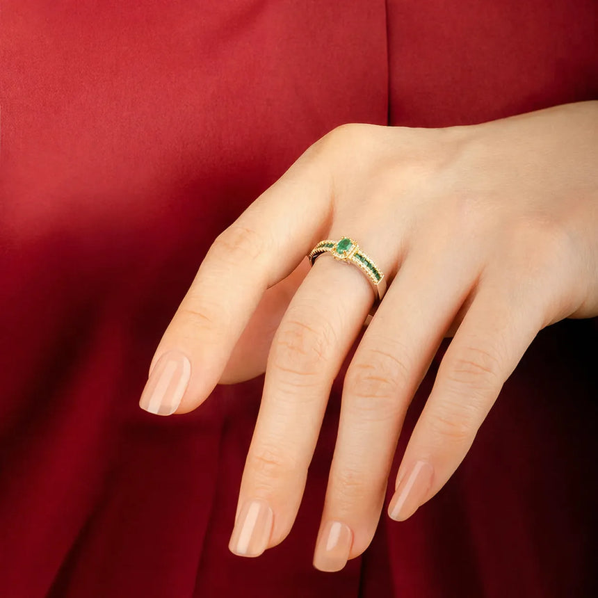 Emerald halo ring with demantoid garnets in 18K yellow gold | SARATTI
