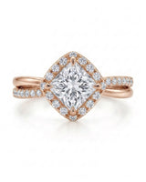 Renea – Majestic Grace Natural Round Diamond Two-Tone Halo Ring