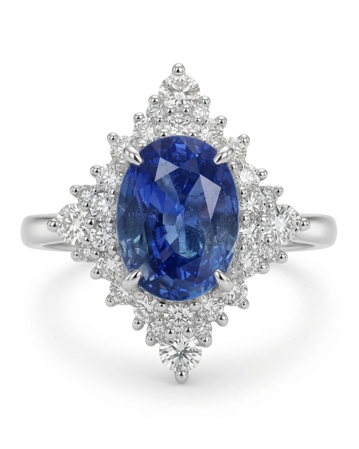 Fine platinum sapphire diamond ring with vivid oval centre and dramatic graduated diamond setting | SARATTI