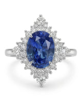 Fine platinum sapphire diamond ring with vivid oval centre and dramatic graduated diamond setting | SARATTI