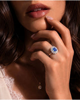 Floral halo sapphire ring with round and pear diamonds in polished 18K white gold | SARATTI