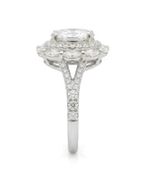 Floral oval moissanite ring with layered side stones and pavé split band in white gold | SARATTI