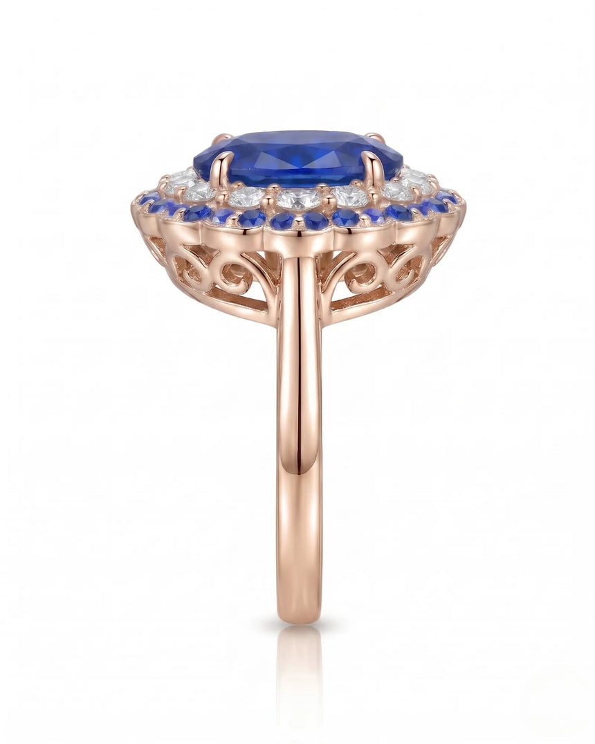 Floral sapphire ring with round diamond halo and blue sapphire border in 18K rose gold | SARATTI