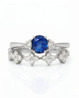 Floral sapphire wedding ring set with round diamond accents in enduring platinum | SARATTI