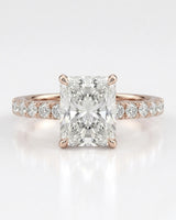 Four-prong radiant diamond ring with round pavé shoulder stones and an 18K rose gold band | SARATTI