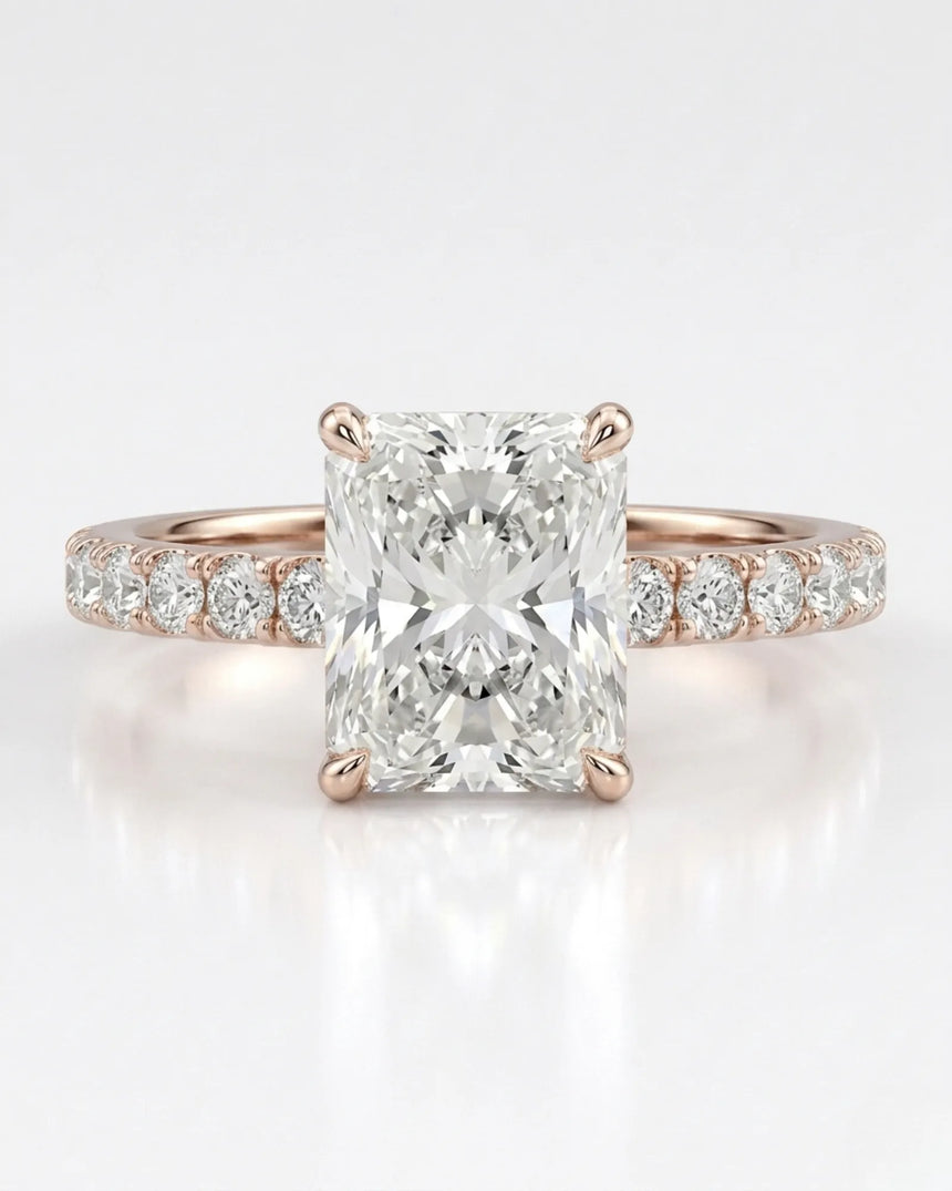 Four-prong radiant diamond ring with round pavé shoulder stones and an 18K rose gold band | SARATTI