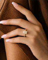 Four-prong radiant diamond ring with round pavé shoulder stones and an 18K yellow gold band | SARATTI