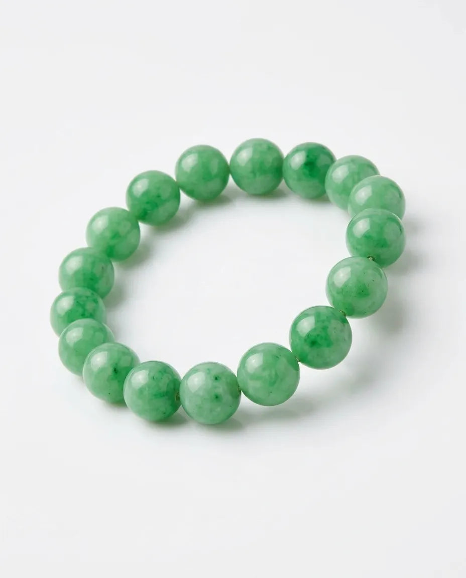 LUCIA apple green jadeite bead bracelet held in hand for scale - SARATTI