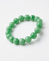 LUCIA apple green jadeite bead bracelet held in hand for scale - SARATTI