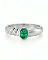 Oval natural emerald sculpted ring in 18K white gold | SARATTI

