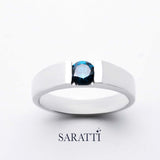 Blue mens wedding band round blue diamond tension set detail in 18K white gold | SARATTI