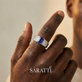 Mens ring with tanzanite and diamonds emerald cut center stone detail in 18K white gold | SARATTI