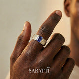 Mens ring with tanzanite and diamonds emerald cut center stone detail in 18K yellow gold | SARATT