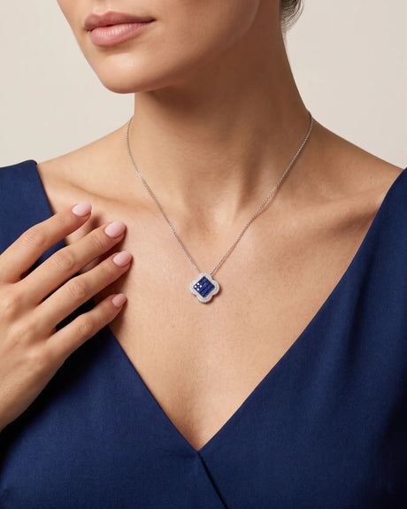 Geometric sapphire pendant necklace with diamond surround and softly sculpted four-lobed 18K gold design | SARATTI
