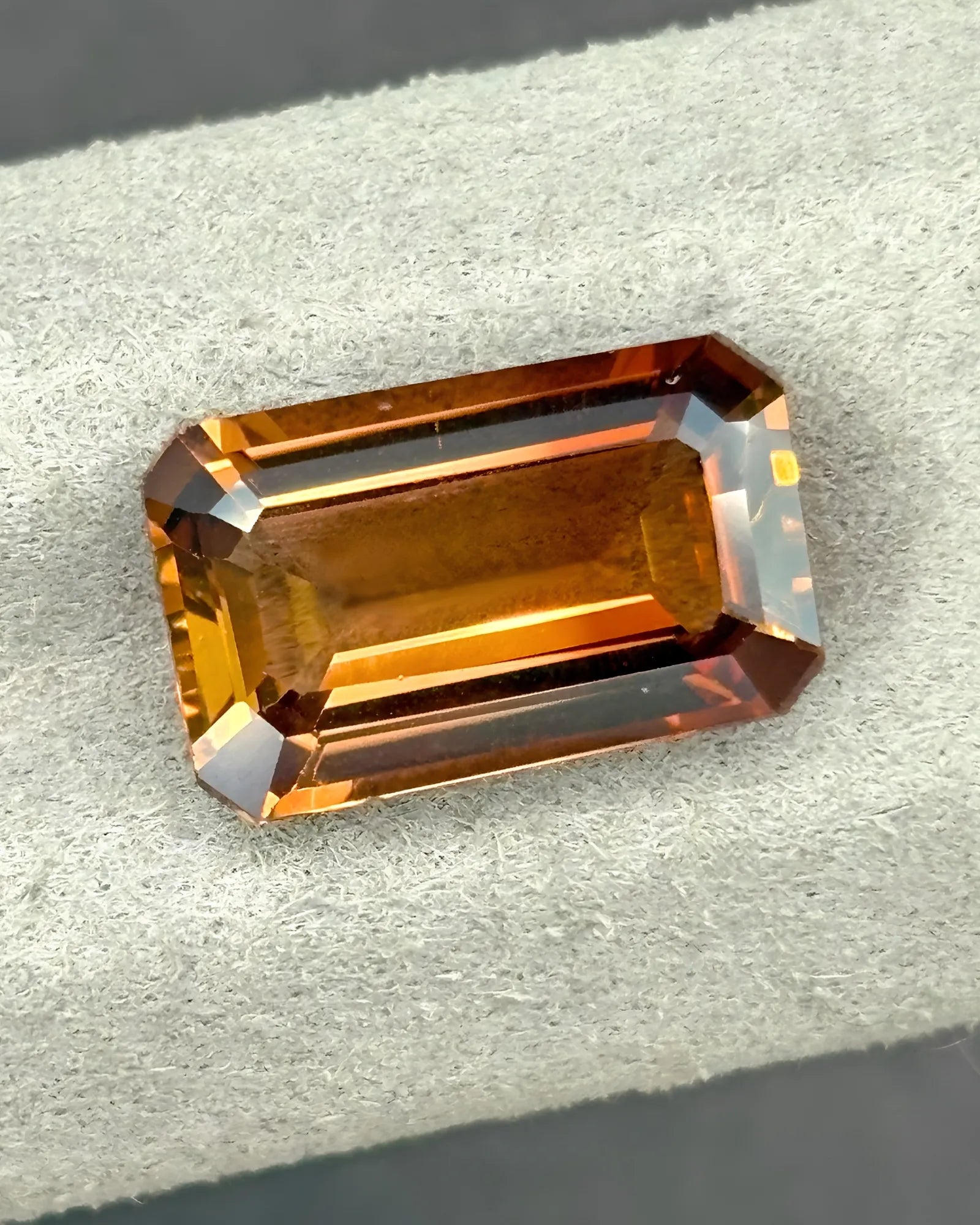 Golden-orange Natural Imperial Topaz loose gemstone close-up | SARATTI