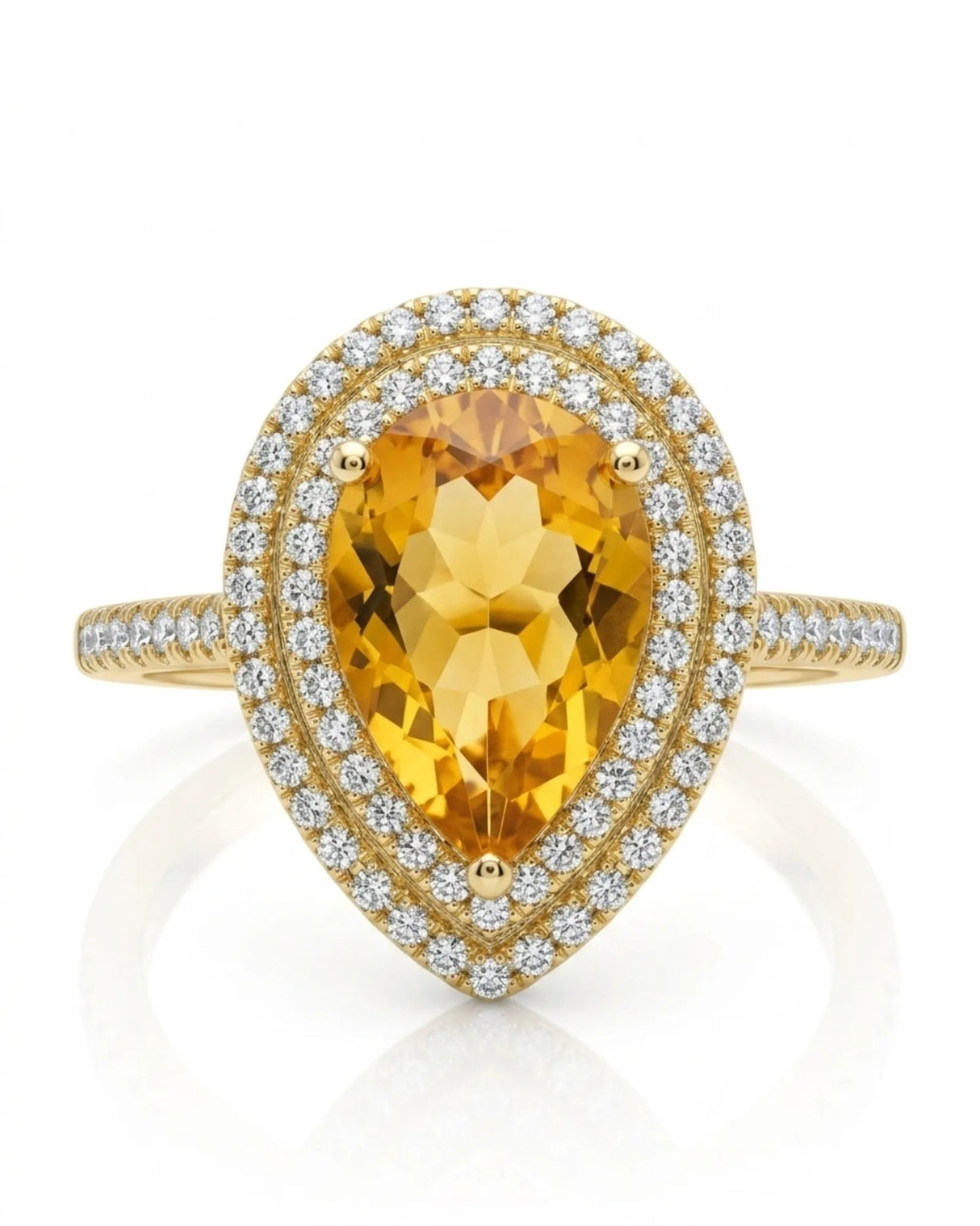 Golden pear-cut citrine surrounded by brilliant diamond halos in a polished 18K yellow gold ring | SARATTI
