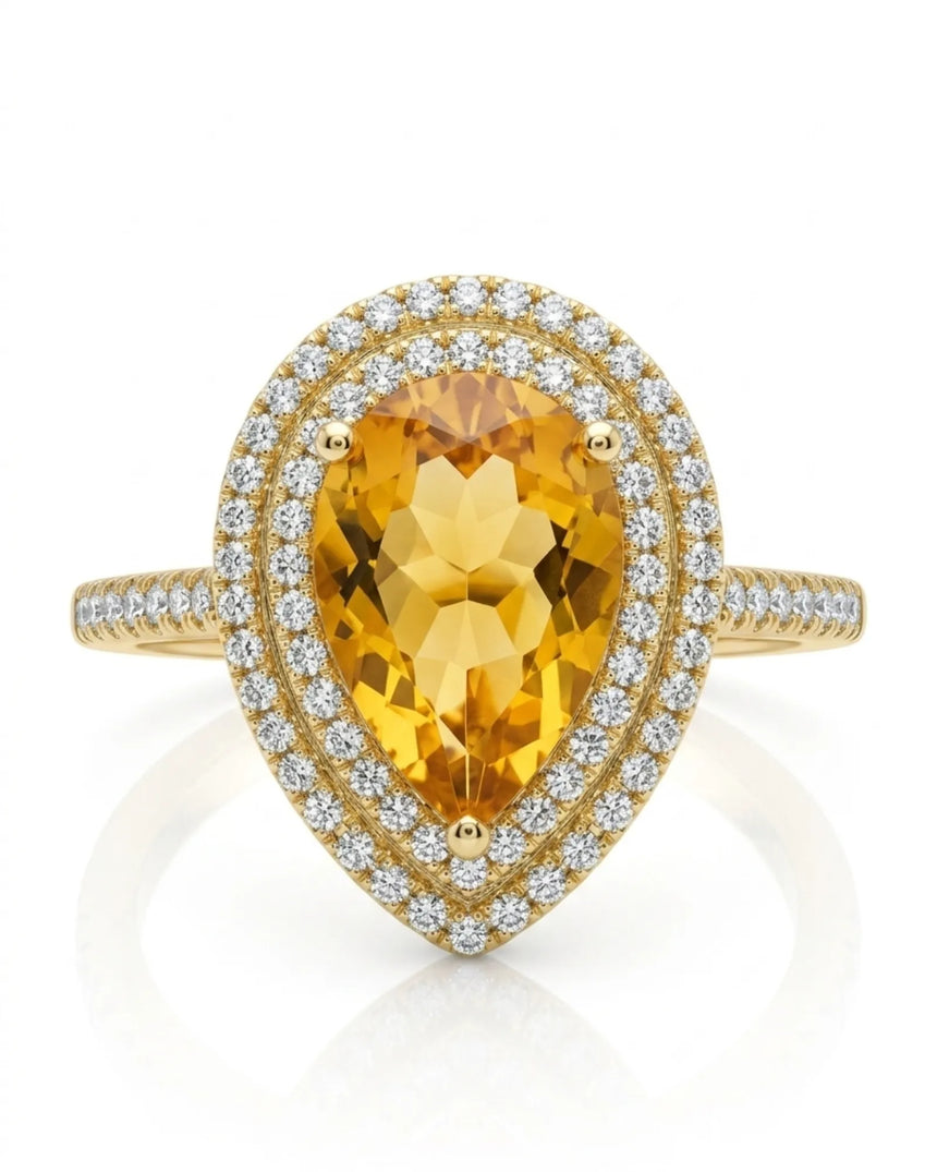 Golden pear-cut citrine surrounded by brilliant diamond halos in a polished 18K yellow gold ring | SARATTI