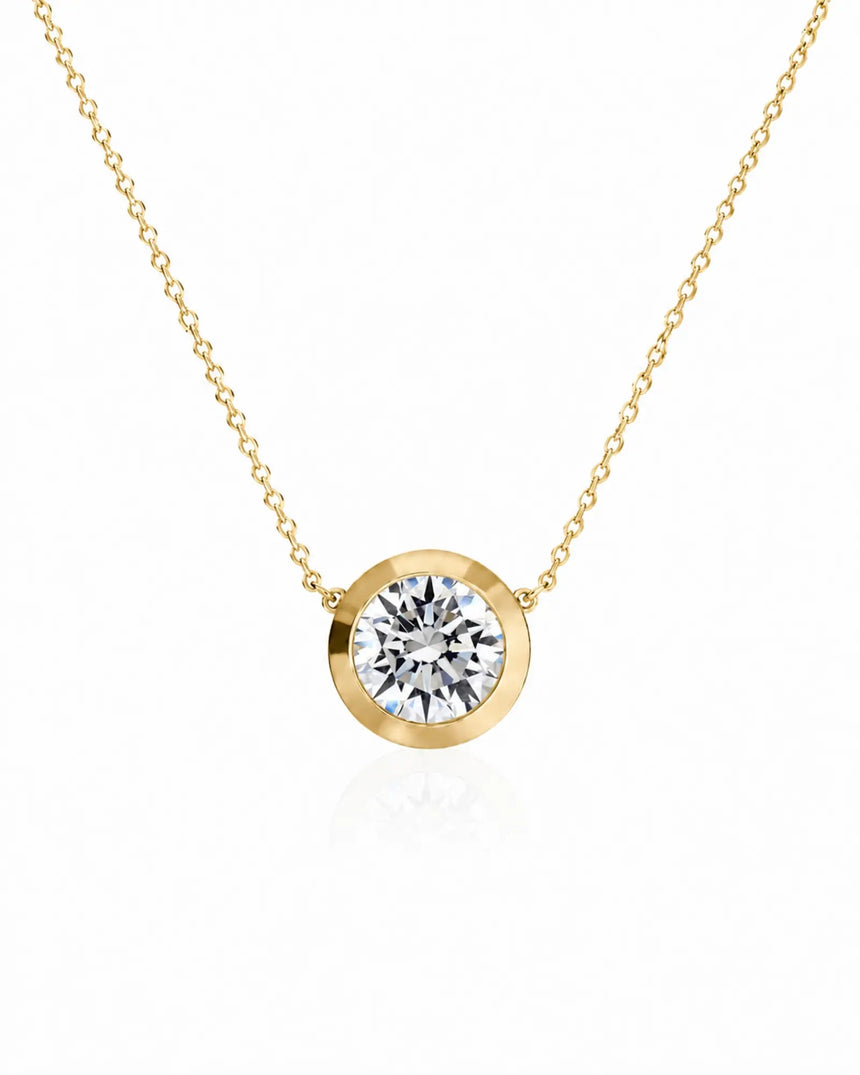 SOLARA Bezel-Set Round Cut solitaire necklace setting in yellow gold, front view | SARATTI