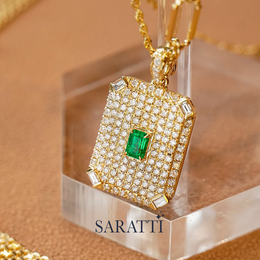 Emerald-cut emerald pavillion pendant surrounded by pavé diamonds | SARATTI