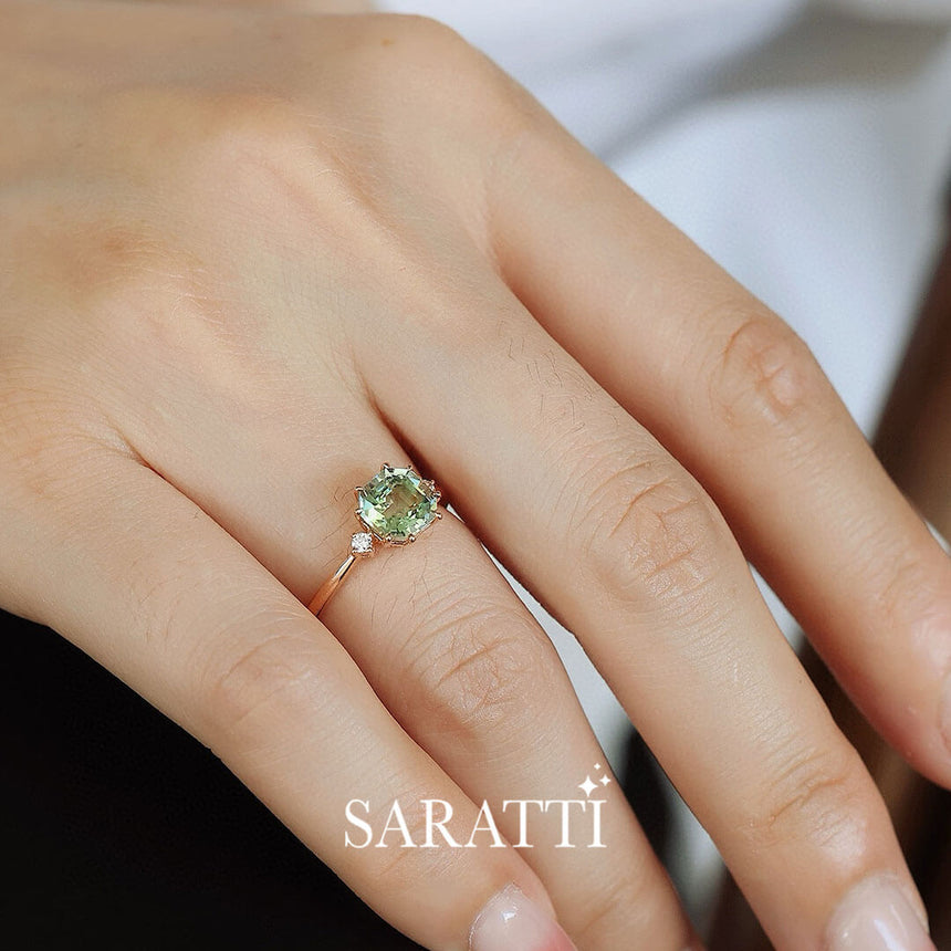 Model sports the dainty Gold Electric Dreams Three Stone Green Tourmaline Ring | Saratti Fine Jewelry 