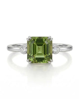 Green Asscher cut tourmaline ring with round diamond side stones in platinum | SARATTI